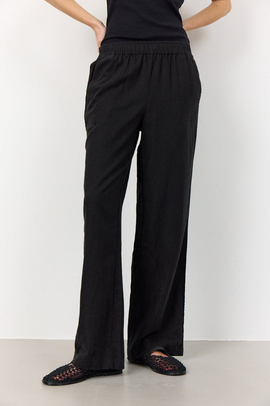 Leveté Room LR-NAJA 7 bukser i sort hørblanding med elastisk linning og brede ben. Elegant, afslappet og komfortabel.