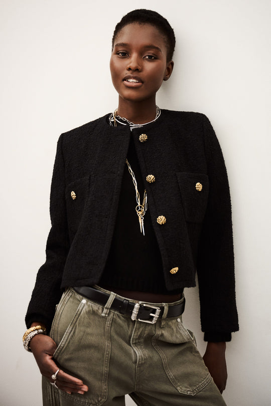 ba&sh Jacket Meredith i sort med rund hals, frontlommer og guldfarvede knapper – crop-jakke i bomuld og uld med elegant finish.