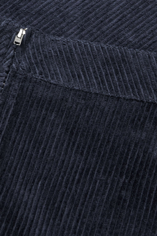 Pretty Cord Stelly Skirt i Parisian Night: A-formet midi-nederdel i 100 % økologisk bomuld med høj talje og sidelommer. Elegant og bæredygtig.