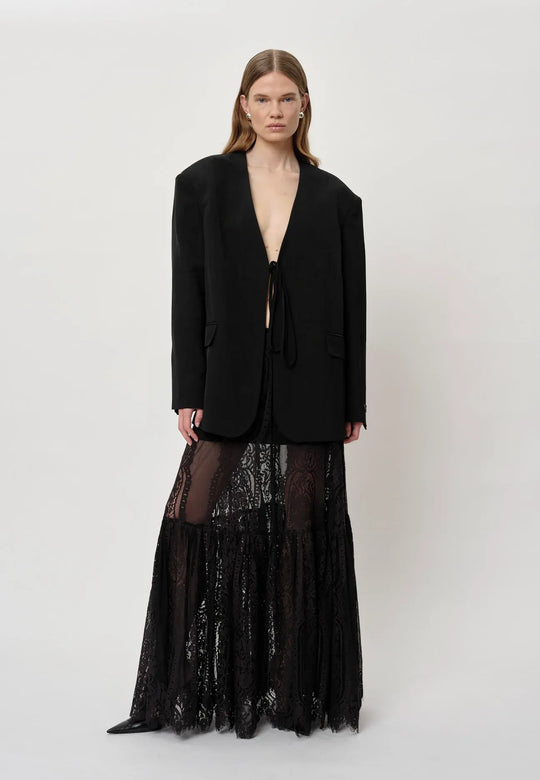 Herskind Patsy Skirt i sort – mid-waisted nederdel med A-form, volumen og underskørt. Fremstillet i OEKO-TEX bomuld og nylon.