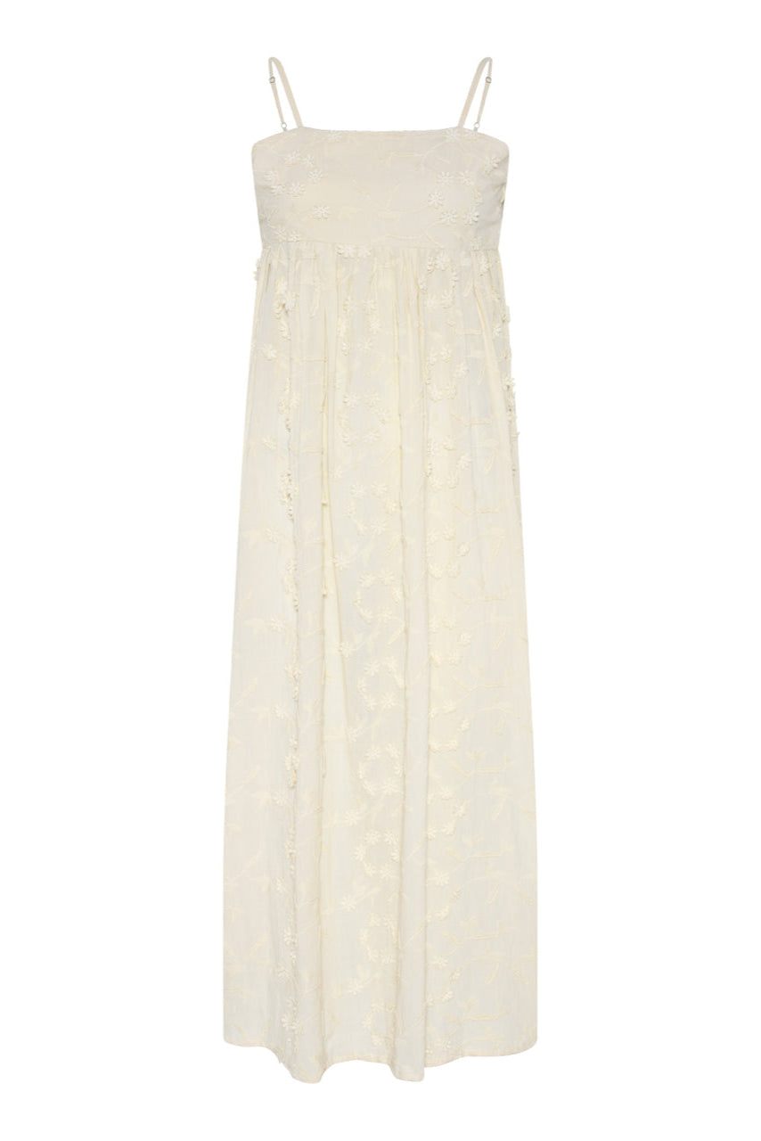 Feminin sommerkjole fra La Rouge i 100% bomuld med 3D-blomster og smøg-effekt i ryggen. Shop Britt Dress i creme online hos