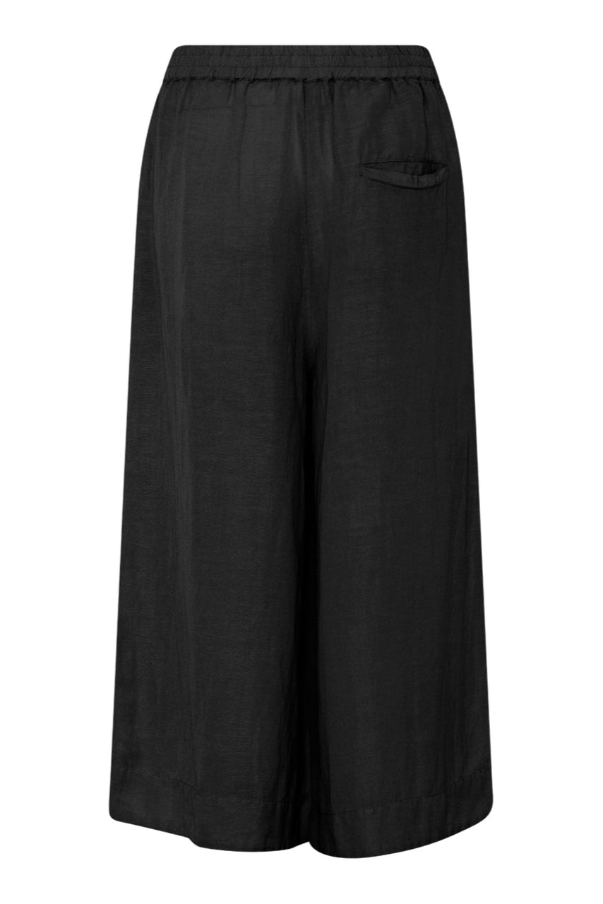 La Rouge Lone Pant i sort – lette og luftige bukser i en komfortabel viskose- og hørblanding med elastisk talje og sidelommer.