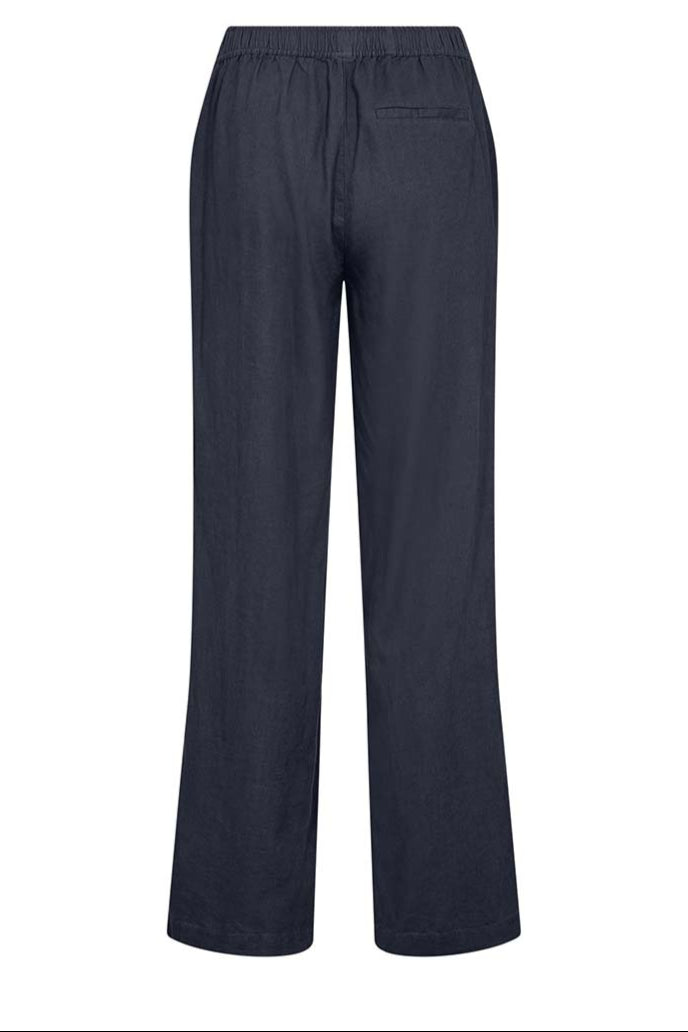 Leveté Room LR-NAJA 7 bukser i dark navy hørblanding med elastisk linning og brede ben. Elegant, afslappet og komfortabel.