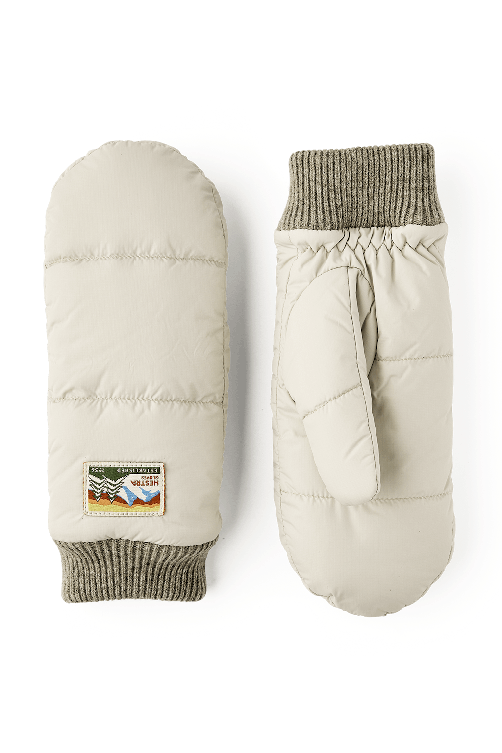 Hestra Otra Luffer i natural beige – quiltede, vindtætte og vandafvisende luffer med PrimaLoft Gold isolering og blødt børstet polyesterfor.
