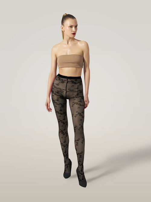 Wolford Floret Tights i sort – strømpebukser med blomsterprint, kombination af transparente og uigennemsigtige sektioner og mat finish.
