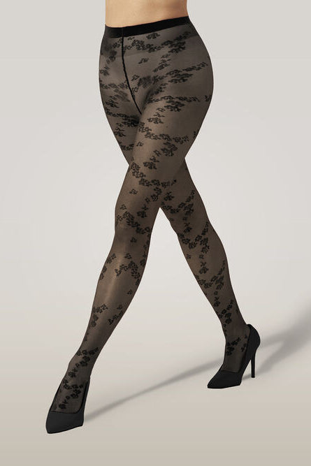 Wolford Floret Tights i sort – strømpebukser med blomsterprint, kombination af transparente og uigennemsigtige sektioner og mat finish.
