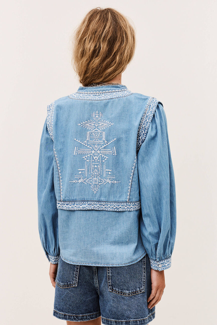 ba&sh Laura Bluse i denim blue – chambray bluse med denim-look, two-in-one design, puffede ærmer og lige pasform.