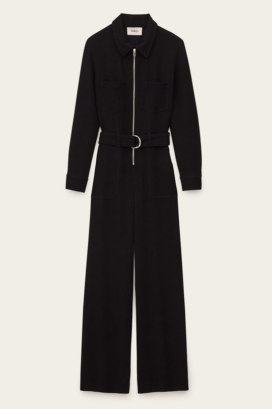 ba&sh Combinaison Fleur Jumpsuit i marine – buksedragt med lige pasform, bælte i taljen, lange ærmer, brystlommer og lynlåslukning foran.
