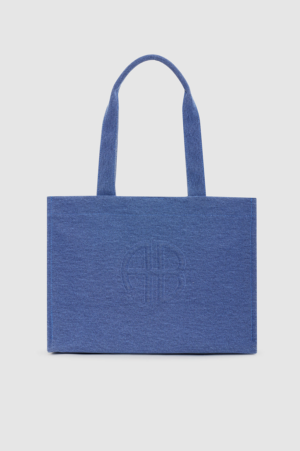 Anine Bing Lara Tote i cascade blue – rummelig canvas tote med sorte læderdetaljer, to håndtag og magnetlukning.