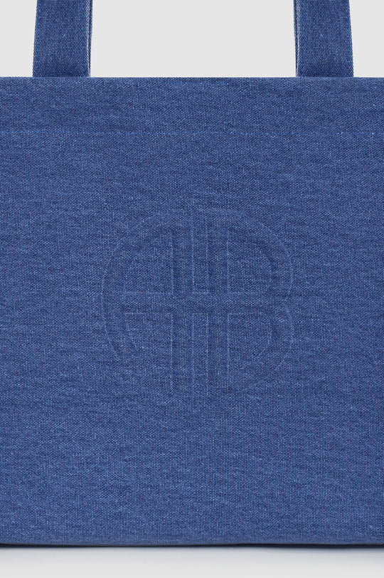 Anine Bing Lara Tote i cascade blue – rummelig canvas tote med sorte læderdetaljer, to håndtag og magnetlukning.