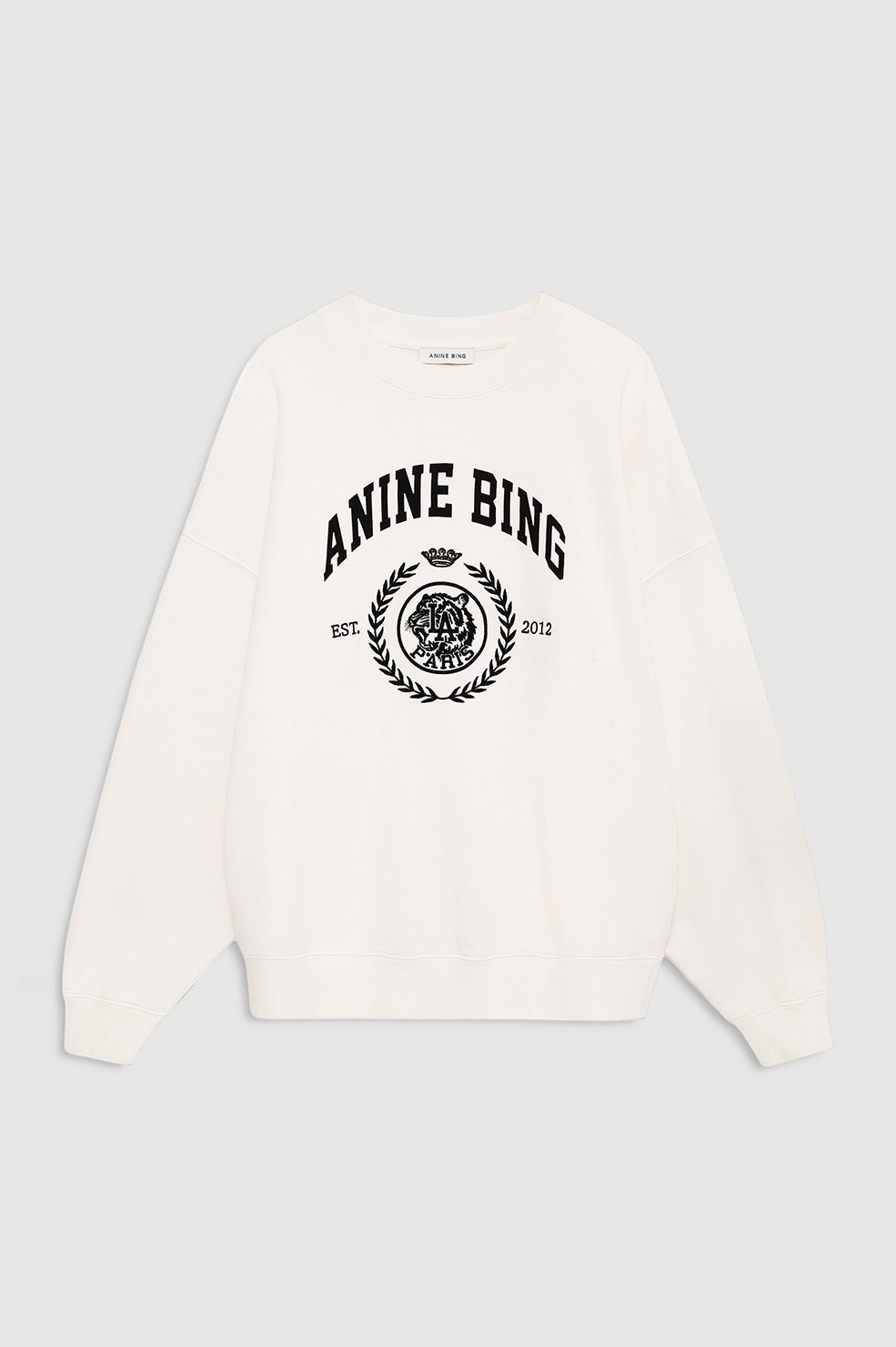 Anine Bing Miles Collegiate Sweatshirt i cream – oversized sweatshirt i bomuldsfleece med ribkanter og collegiate ANINE BING-logo foran.
