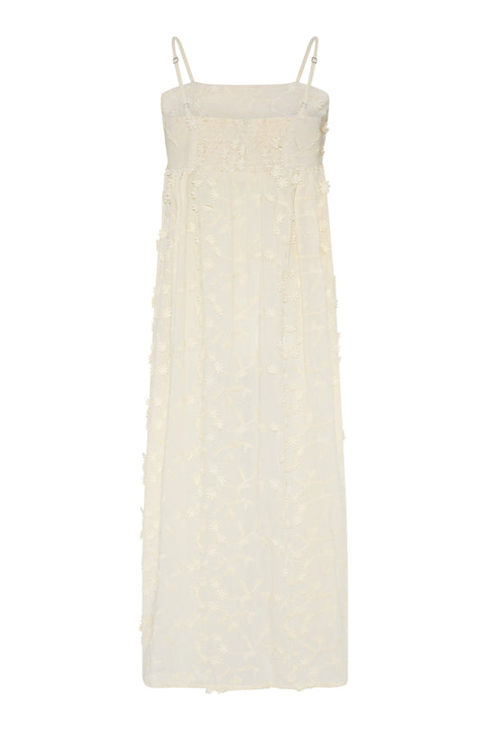 Feminin sommerkjole fra La Rouge i 100% bomuld med 3D-blomster og smøg-effekt i ryggen. Shop Britt Dress i creme online hos 