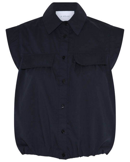 La Rouge Vilma top i navy med knaplukning og elastisk kant.